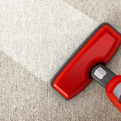 red-vacuum-cleaner-cleaning-carpet_613961-348